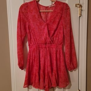 Mi Ami Hot pink dressy mini romper with sheer sleeves and back.